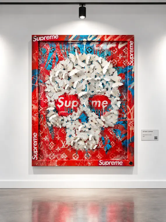 Butterfly Supreme, white butterflies forming a skull on a red canvas